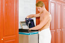 Someone Using the Suitmate Swimsuit water extractor at a gym